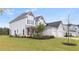 Stately home featuring a manicured lawn and a three-car garage at 3330 Carswell Bnd, Cumming, GA 30028