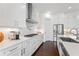 Modern kitchen with white cabinets, stainless steel appliances, and a farmhouse sink that offers plenty of counter space at 3330 Carswell Bnd, Cumming, GA 30028