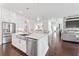 Spacious kitchen with stainless appliances, open to dining and living areas, great for entertaining guests and Gathering at 3330 Carswell Bnd, Cumming, GA 30028