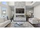 Inviting living room with a stone fireplace, hardwood floors, and an open concept at 3330 Carswell Bnd, Cumming, GA 30028