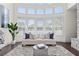 Bright living room featuring a cozy sofa, hardwood floors, and lots of natural light at 3330 Carswell Bnd, Cumming, GA 30028