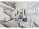 Bright living room with soaring ceilings, large windows and cozy seating with a view of the second floor balcony at 3330 Carswell Bnd, Cumming, GA 30028