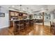Finished basement with a custom-built bar, hardwood floors, and comfortable seating at 3665 Pennington Rd, Cumming, GA 30041