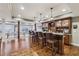 Finished basement with a custom bar, lots of seating and neutral colored walls at 3665 Pennington Rd, Cumming, GA 30041