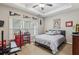 Cozy bedroom with a ceiling fan, lots of natural light and neutral colored walls at 3665 Pennington Rd, Cumming, GA 30041