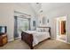 Cozy bedroom with vaulted ceilings, carpet floor, and large window at 3665 Pennington Rd, Cumming, GA 30041