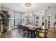Spacious formal dining room with crown molding, wainscoting, and natural light at 3665 Pennington Rd, Cumming, GA 30041