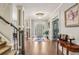 Spacious foyer with hardwood floors, elegant staircase, and classic decor, creating a grand entrance at 3665 Pennington Rd, Cumming, GA 30041