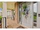 Inviting front porch with brick flooring, decorative wreath, and bench seating, offering a cozy entrance at 3665 Pennington Rd, Cumming, GA 30041