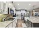 Well-appointed kitchen with stainless steel appliances, granite countertops, and stylish finishes, perfect for cooking at 3665 Pennington Rd, Cumming, GA 30041