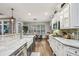 Modern kitchen with stainless steel appliances, granite countertops, and a large island, perfect for cooking at 3665 Pennington Rd, Cumming, GA 30041