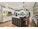 Gourmet kitchen with a central island, stainless steel appliances, and custom cabinetry, ideal for entertaining at 3665 Pennington Rd, Cumming, GA 30041