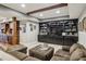 Basement with a comfortable seating area and a large built-in entertainment center at 3665 Pennington Rd, Cumming, GA 30041