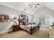 Elegant main bedroom features a tray ceiling, large windows, and plush furnishings at 3665 Pennington Rd, Cumming, GA 30041