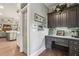 Functional mudroom/office area with custom cabinetry, a built-in desk, and great storage at 3665 Pennington Rd, Cumming, GA 30041