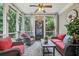 Relaxing screened porch with comfortable seating, ceiling fan, and views of the backyard at 3665 Pennington Rd, Cumming, GA 30041