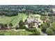 Aerial view of a golf course community with lush greenery, offering a picturesque and serene environment at 119 Kennemer Ct, Johns Creek, GA 30097