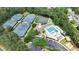 Overhead view captures the tennis courts and the community pool with ample parking surrounded by trees at 119 Kennemer Ct, Johns Creek, GA 30097