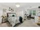 A stylish bedroom features a chandelier, and a desk at 119 Kennemer Ct, Johns Creek, GA 30097
