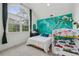 Bright and airy bedroom features a bunk bed, a bed, and a large arched window at 119 Kennemer Ct, Johns Creek, GA 30097