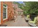 Spacious deck with wood swing, outdoor seating, and string lights, perfect for relaxing and entertaining at 119 Kennemer Ct, Johns Creek, GA 30097