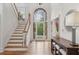 Bright foyer with beautiful leaded glass door, stairs, hardwood floors, and high ceilings at 119 Kennemer Ct, Johns Creek, GA 30097