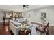 Inviting living room with hardwood floors, a decorative rug, and a bar area, perfect for entertaining at 119 Kennemer Ct, Johns Creek, GA 30097