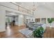 Bright living room featuring hardwood floors, soaring ceilings, a chandelier, and second floor gallery at 119 Kennemer Ct, Johns Creek, GA 30097