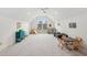 Spacious playroom featuring vaulted ceilings, arched window, and ample natural light at 119 Kennemer Ct, Johns Creek, GA 30097
