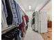 A well-organized walk-in closet provides ample storage with rods, shelving, and an open doorway at 119 Kennemer Ct, Johns Creek, GA 30097
