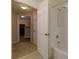 Cozy bathroom with a tub, white tile and modern fixtures, perfect for relaxing at 8020 Woodland Ln, Alpharetta, GA 30009
