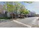 Townhome complex with mature trees and sidewalks at 8020 Woodland Ln, Alpharetta, GA 30009
