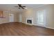 Spacious living room with hardwood floors, a fireplace, and plenty of natural light at 8020 Woodland Ln, Alpharetta, GA 30009