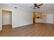 Open-concept living space with wood flooring, neutral walls, and ample natural light at 8020 Woodland Ln, Alpharetta, GA 30009