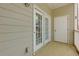 Enclosed patio featuring white doors to the home's interior at 8020 Woodland Ln, Alpharetta, GA 30009
