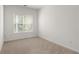 Bedroom with neutral carpet, natural light and ample space at 90 Grove Park Ln, Woodstock, GA 30189