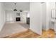 Open-concept living space with a fireplace, bar, and half bath, perfect for entertaining at 90 Grove Park Ln, Woodstock, GA 30189