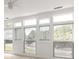 Bright living room featuring large windows that offer abundant natural light and pleasant views at 90 Grove Park Ln, Woodstock, GA 30189