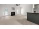 Bright living area with a fireplace, French doors, and a bar featuring granite countertops at 90 Grove Park Ln, Woodstock, GA 30189