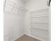 Walk-in closet with wire shelving for organized storage of clothes and personal items at 90 Grove Park Ln, Woodstock, GA 30189