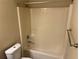 Clean bathroom featuring a shower-tub combination with modern fixtures and a towel rack at 3140 Tylerton Sw Dr, Atlanta, GA 30311