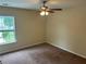 Cozy bedroom with plush carpet and a window overlooking the outdoors at 3140 Tylerton Sw Dr, Atlanta, GA 30311