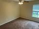 Comfortable bedroom with carpet, a ceiling fan and natural light creating a cozy atmosphere at 3140 Tylerton Sw Dr, Atlanta, GA 30311