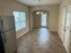 Bright dining area featuring linoleum floor, window, and a door to back yard at 3140 Tylerton Sw Dr, Atlanta, GA 30311