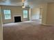 Bright open living room featuring carpet, a fireplace, and access to other rooms at 3140 Tylerton Sw Dr, Atlanta, GA 30311