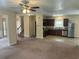 Bright and open living room adjacent to stairs, front entry, and kitchen at 3140 Tylerton Sw Dr, Atlanta, GA 30311