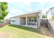 Rear exterior and fenced backyard with a covered patio and trimmed lawn at 3397 Long Creek Drive, Buford, GA 30519