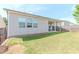 Exterior shot of the house showcasing the backyard and a covered patio at 3397 Long Creek Drive, Buford, GA 30519