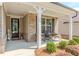 Charming front porch with chairs and decorative plants at 3397 Long Creek Drive, Buford, GA 30519