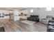 Open-concept living room flows into a modern kitchen with stainless steel appliances and a large island at 3397 Long Creek Drive, Buford, GA 30519
